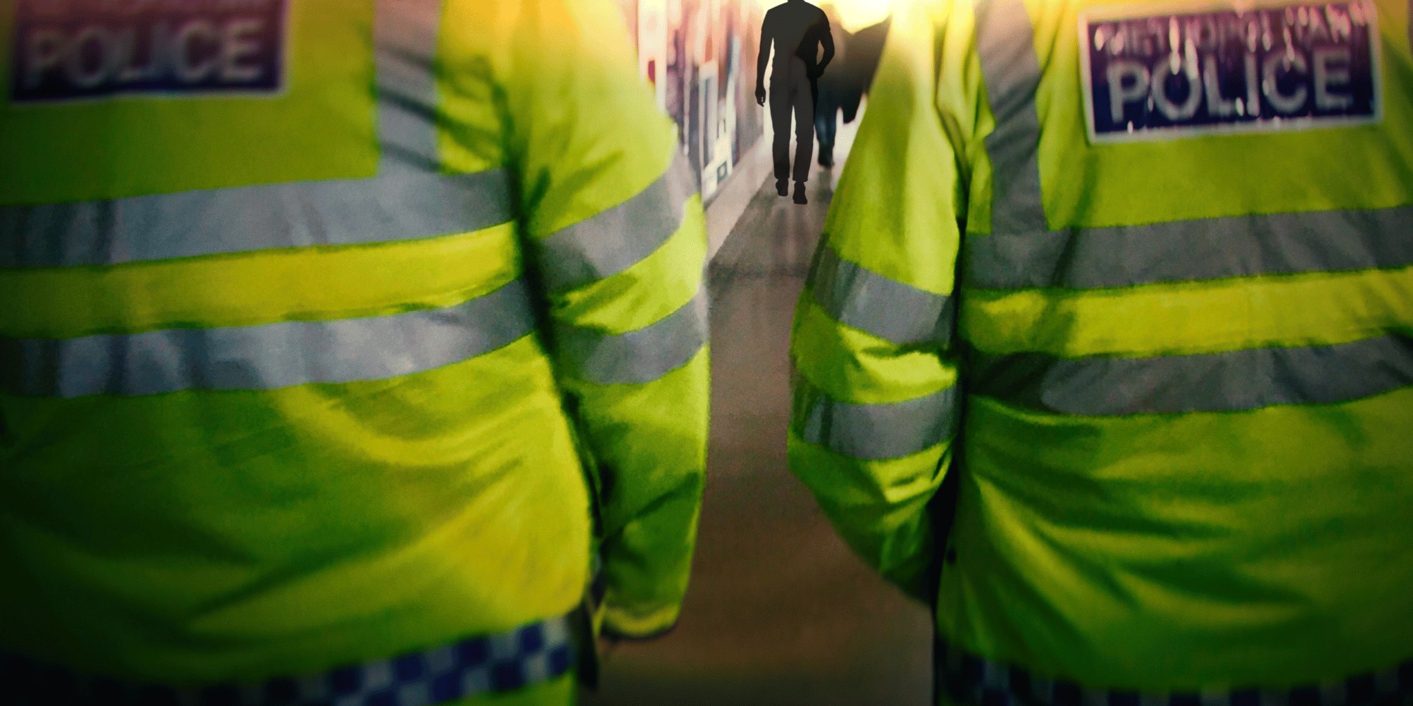 People wearing high-visibility jackets seen from behind