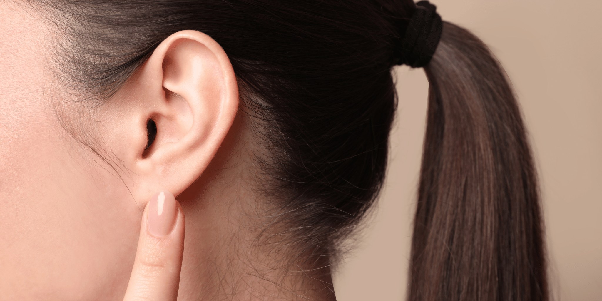 A close-up photograph of a person's ear