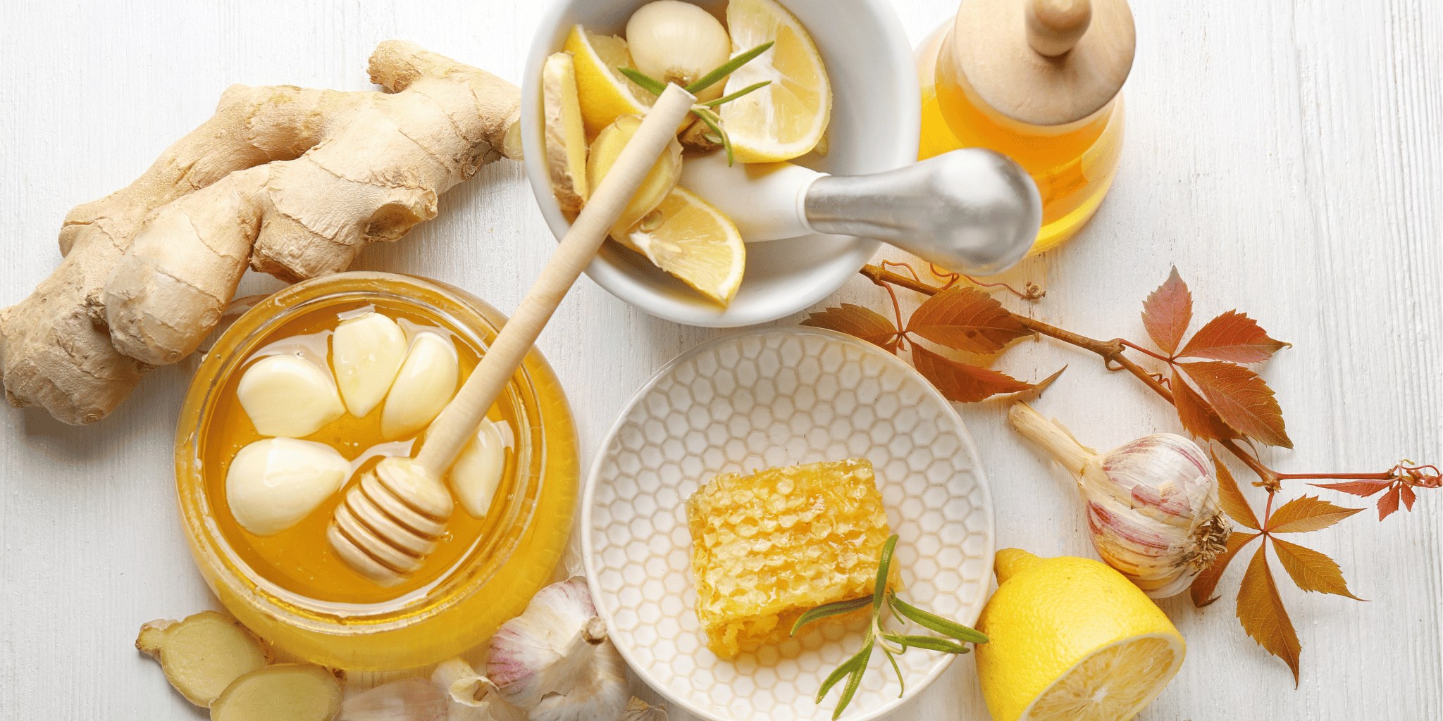 Honey, lemon and ginger laid out as cold remedies
