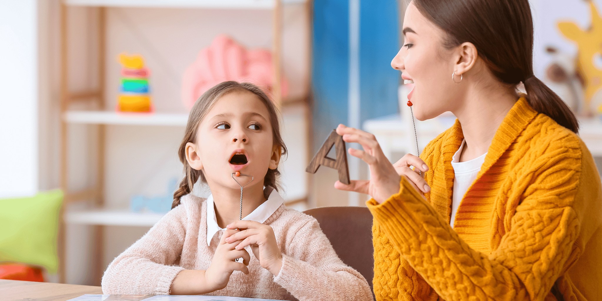 A girl looking shocked while sitting beside a woman